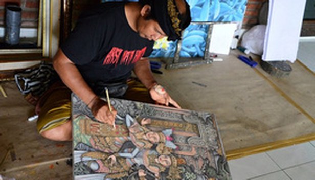 Balinese artist painting in the art village