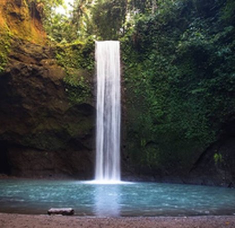Tibumana Waterfall falling into a turquoise pool