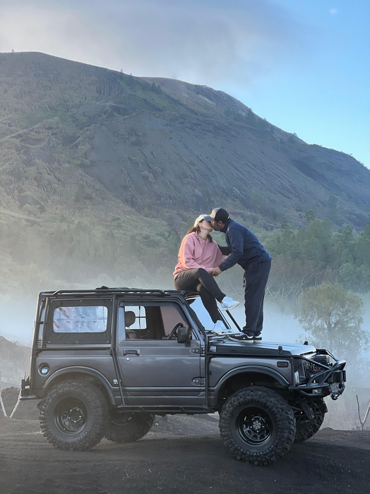 4x4 jeep on the black lava fields of Mount Batur at sunrise